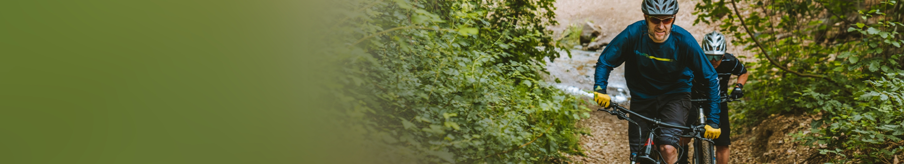 two people in trail cycling